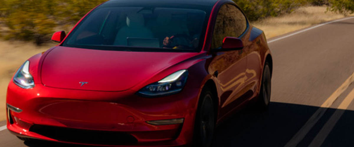 A red Tesla racing through the Arizona desert, a naturally dry climate that's ideal climate for testing