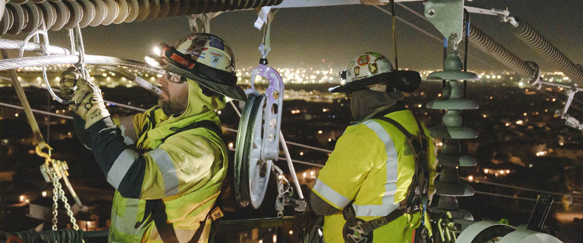 Electrical lineworkers working to maintain power lines in Arizona, a top-ranked state in power reliability.