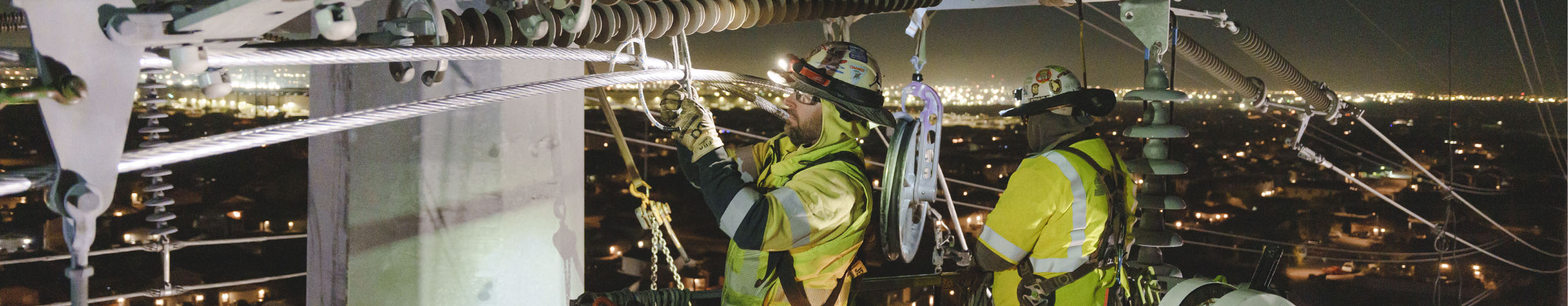 Electrical lineworkers working to maintain power lines in Arizona, a top-ranked state in power reliability.